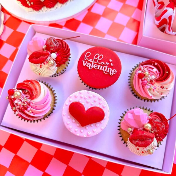 Valentine’s Special Cup Cakes with heart decorations and creamy frosting.