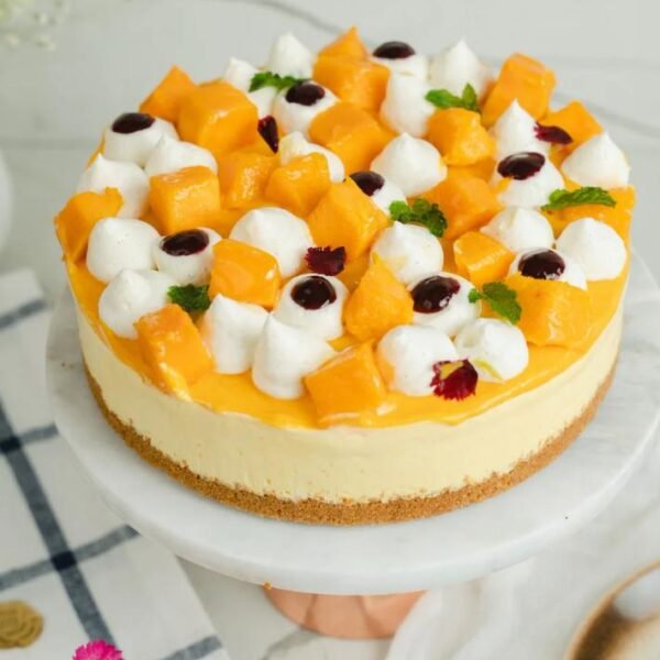 Slice of Blueberry Cheesecake with a buttery biscuit base and blueberry compote topping