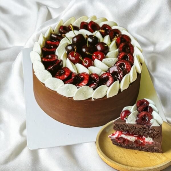Black Forest Chocolate Cake with layers of chocolate sponge, fresh cream, and cherries for celebration